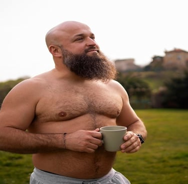 A fat man holding a Cup in the Garden