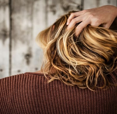Girl holding her hair