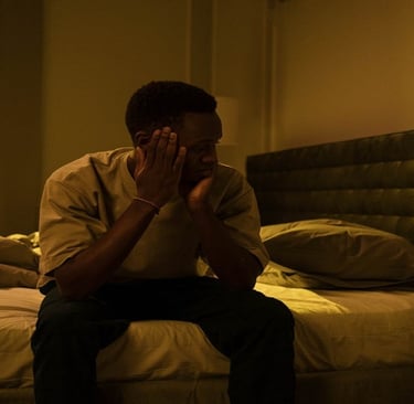 A man sitting on the bed