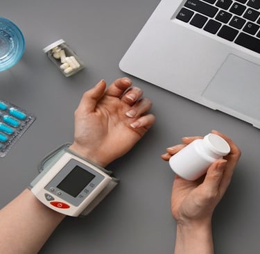 Blood pressure monitor, medicines, and laptop