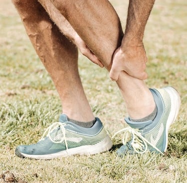 Man holding his Ankle