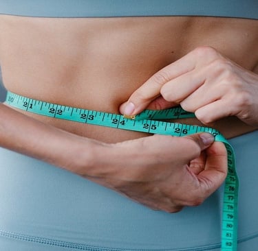Measuring tape around woman's waist