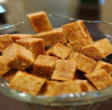 Brown sugar cubes in a glass bowl