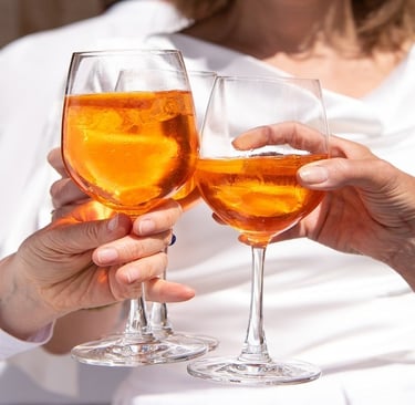 People holding alcohol in glass