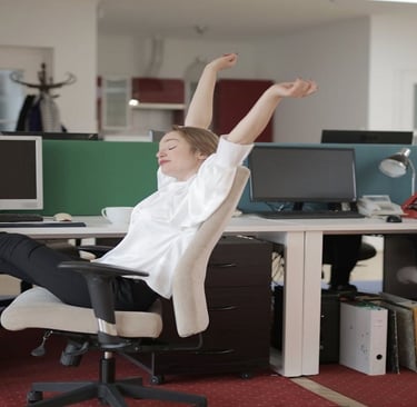 A Girl Relaxing in Office Chair