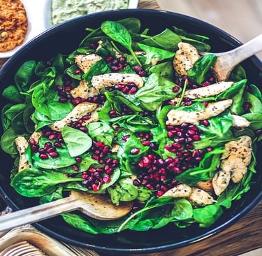 Spinach, Chicken, and Pomegranate in a Bowl