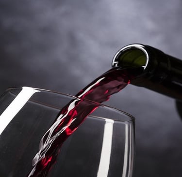 Pouring red wine in a glass