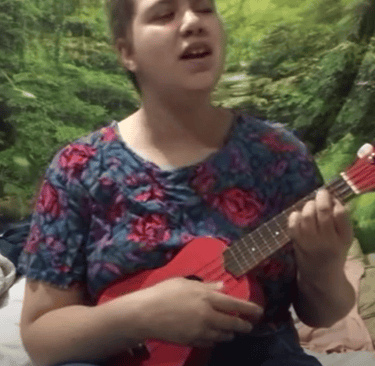 Me, Ella, Holding my ukulele and singing