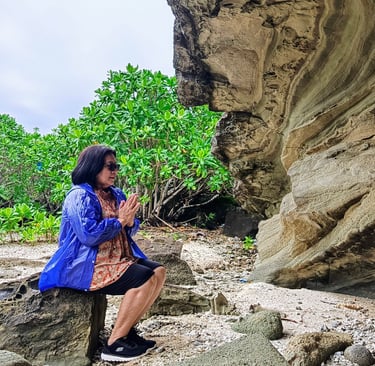Woman Meditating at Rock Formation