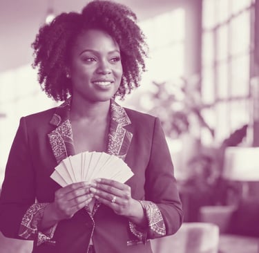 A black woman holds a fan of business cards in her hands