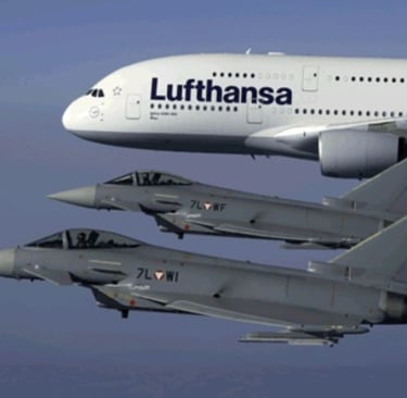 An airbus and a fighter jet