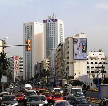 morocco casablanca a busy street with cars parked on the side of the road