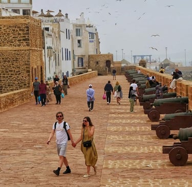 morocco a couple holding hands while walking down a path