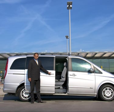 morocco a man in a suit and tie standing in front of a van