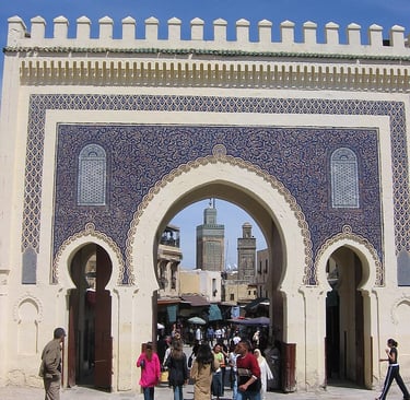 morocco fes a group of people walking through a building