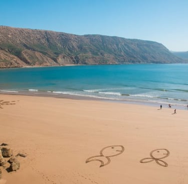 Morocco a couple of people walking on a beach