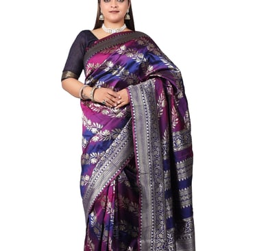 a woman in a multycolor sari 