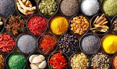 a variety of  nilgiris spices and wholesale spices in a variety of bowls