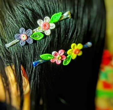 Recycle paper flower hair clips on the wear 