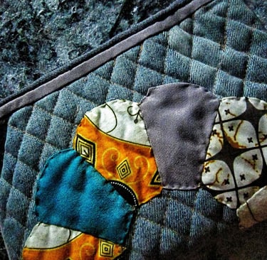Recycled fabric pouch with colorful applique fro beautiful pouch