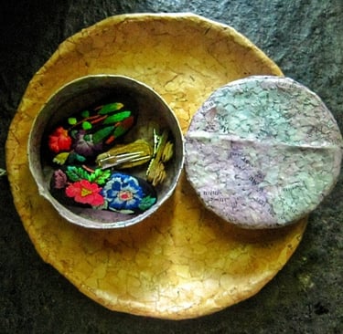 Recycled paper purple jewelry case opened on recycle paper brown plae 