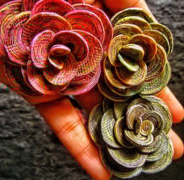Recycled paper marble rose on the hand 