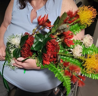 Native flower bouquet being held