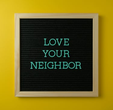 a blackboard with the words love your neighbor