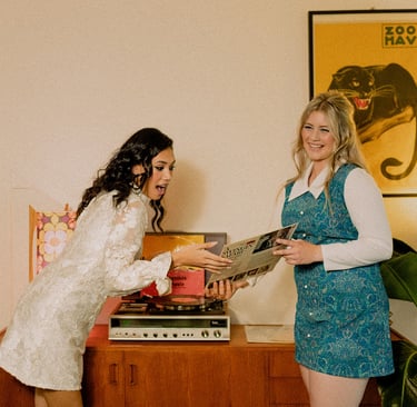 1960s styled brand shoot for Closet Mod Clothing Adelaide. Two models stand with a record player.