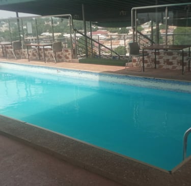 nim avenue pool with a swimming pool and a swimming bar pool