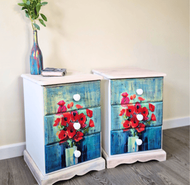 A pair of bedside tables painted white with 'Poppy' design decoupage