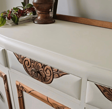 Angle view of sideboard painted in Sophie James Cream Dream to show the carved wood detail