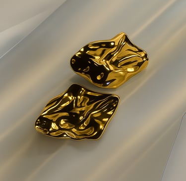 two gold plated dishes with a gold plated bowl