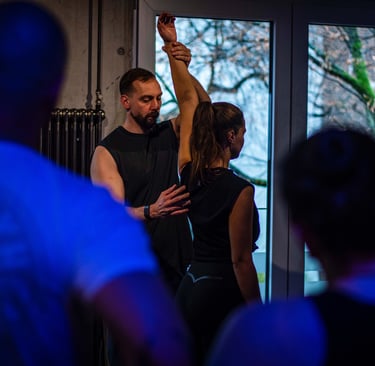 a man and woman dancing in a dance floor