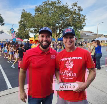 Austin Arthur with firefighter supporter wearing Firefighters for Austin Arthur shirts at a communit