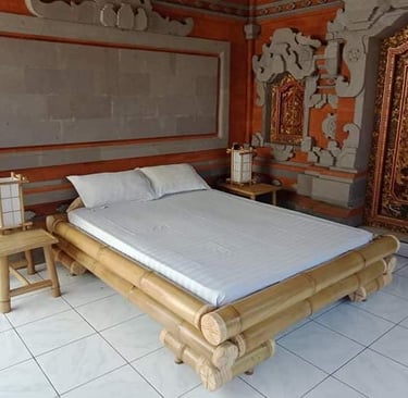 a bed with a wooden bed frame and a white bed