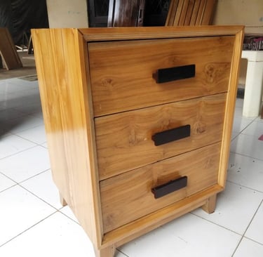 a wooden chest made in bali of drawers with a drawer underneath