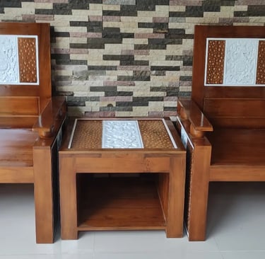 two wooden chairs with a table and chairs