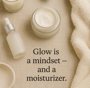 Flat lay of a glass moisturizer jar, dropper serum, eucalyptus sprig, and candle on a neutral beige