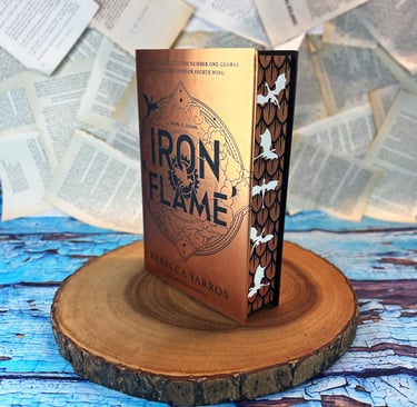 Iron Flame book with stenciled edges. gold scales with white dragons.