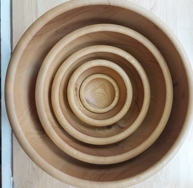 a set of hand turned nesting wood bowls