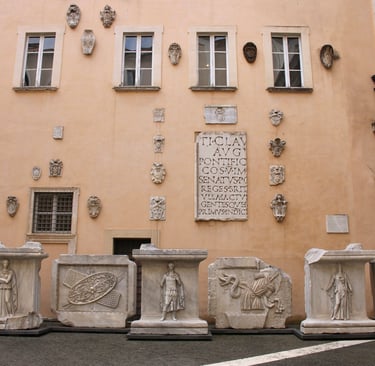 Rome capitolini museum a building with a large stone wall with a large number of statues