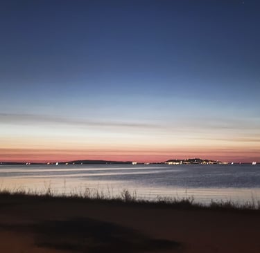 Sunrise over the Etang du Thau with Sete on the horizon
