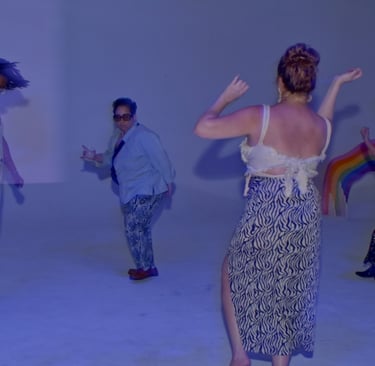 A group of women and queer people dancing at a wedding reception