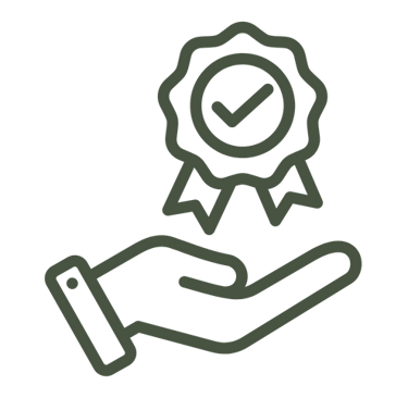 a hand holding a certificate with a green ribbon around it