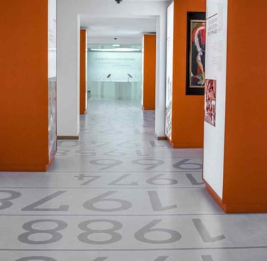Custom Designed Stamped Concrete Gray Office Floor with Dark Orange Walls
