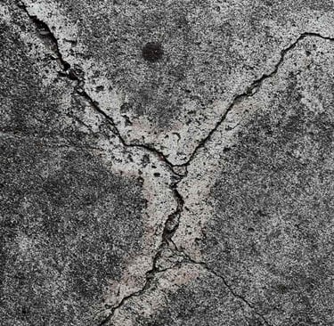Cracked concrete surface in need of repair and sealing.Fixing and protecting your concrete surfaces.