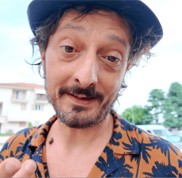 a man with a hat and a hat on