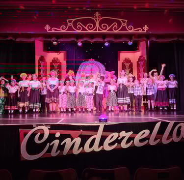 Photo of the cast of Cinderella on the stage at Theatr Colwyn
