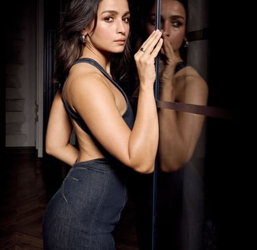 a woman in a dress standing in front of a mirror